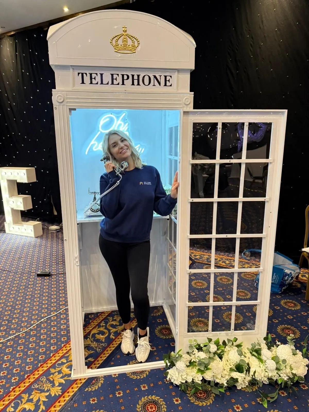 All Time Events team member in the telephone box guestbook at a venue setup